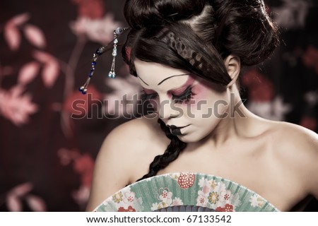 stock photo stylized picture of a Japanese geisha makeup done by 