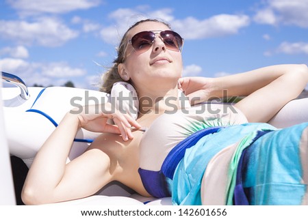 Beautiful woman relaxing on the boat cruise