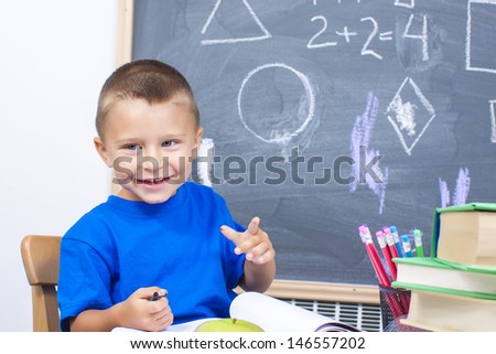 first grade student smiling in classroom