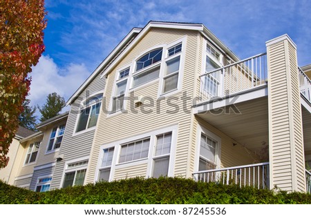 luxury suburban houses in sunny day with blue sky