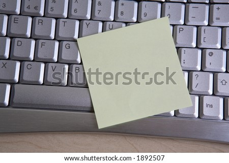 Blank post it note on keyboard
