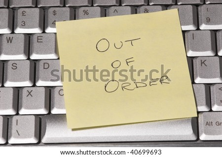 Out of order sticker on computer keyboard