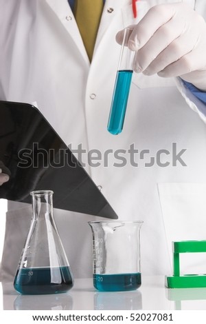 Research scientist looking at results