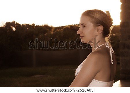Beautiful blonde girl portrait at sunset.