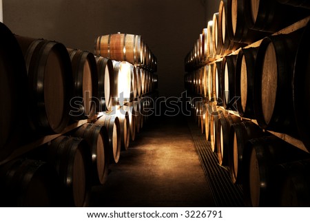 French Oak barrels with wine being stored in Pleisir de Merle wine cellar in Franschhoek, Western Cape, South Africa