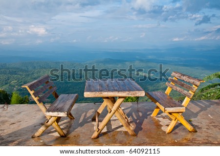 With two chairs to sit on the mountain for the view.
