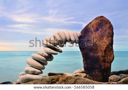 Connecting link  of the handful of pebbles and boulder