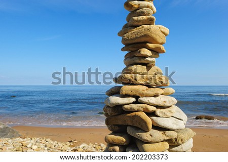 Pyramidal stack of pebbles on the coast
