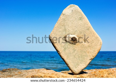 Rectangular stone set in balance in the one point