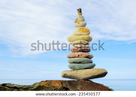 Zen balance of pebbles on the seacoast