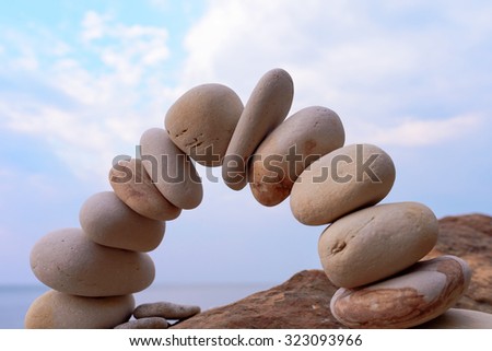 Pebbles in the form of a arch on the coast