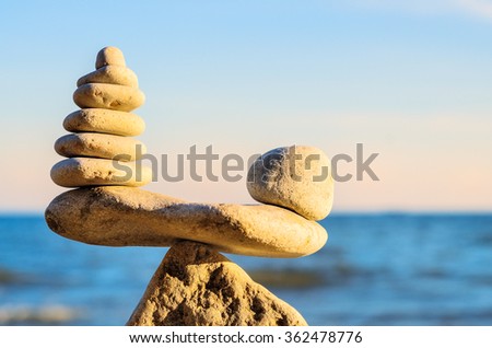 Stack of zen stones in balance at seashore
