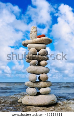Tower of white pebble as Pagoda on the coast