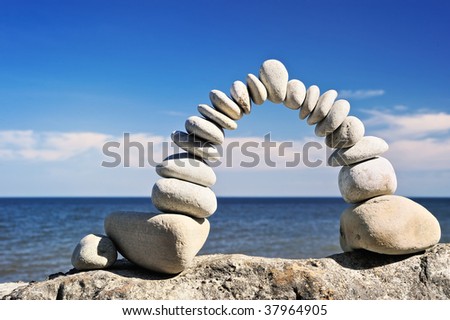 Arched bend composed of white gravel on the sea shore