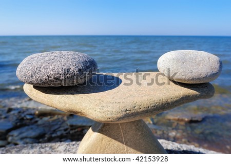 Model of Scales is made of stones on the seashore