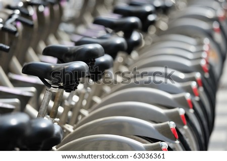 Group of bicycles in the row.  Photo with tilt-shift lens