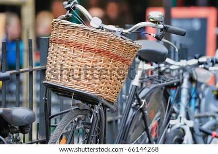 Bicycle with wicker basket on the city street. Photo with tilt-shift lens