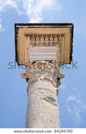 Ancient marble column against the blue sky. Rome, Italy