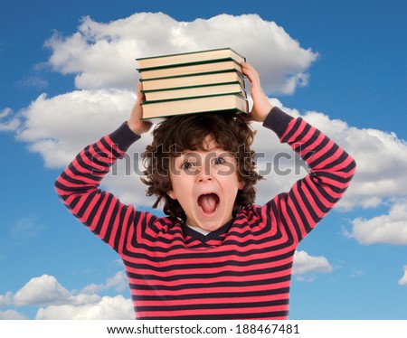 Crazy child shouting with books on the head