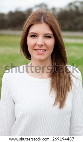 Cool young woman relaxing in the countryside
