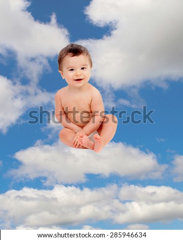 Funny baby in diaper sitting on a cloud on the sky