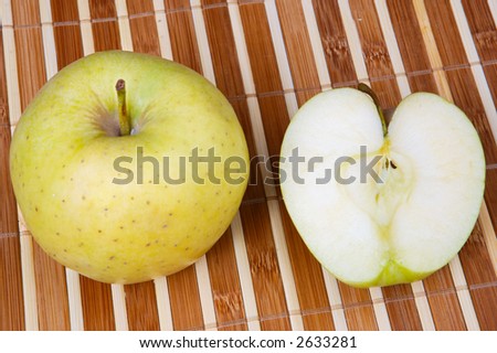 whole apple and half of an apple in heart form