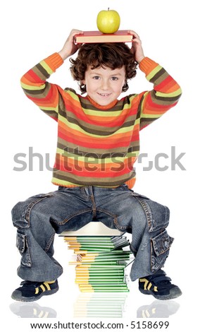 Adorable child studying with books and apple in the head reflected in the ground