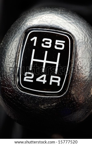 photo of a gear stick of a car - a over black background -