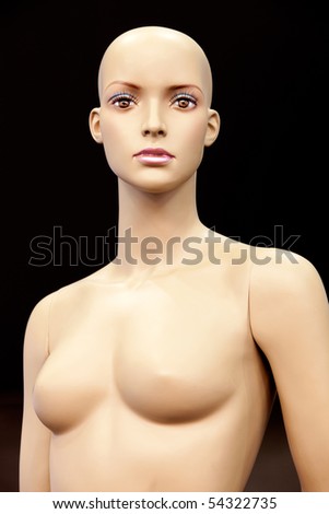 Bald girl mannequin isolated on black background