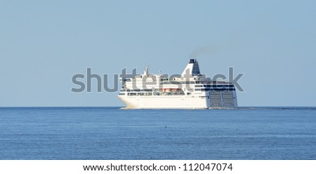 passenger ferry ship leaving port of Riga