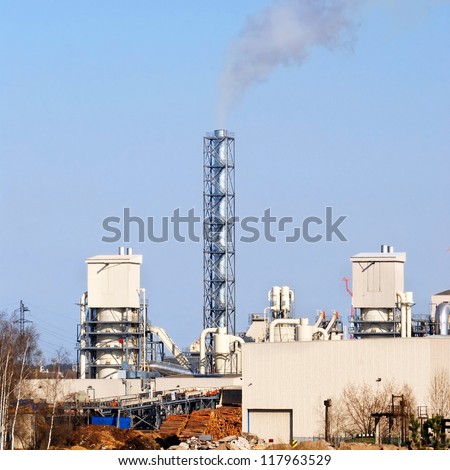 industrial plant. Factory with pipes against blue sky