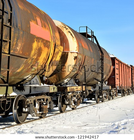 grunge cargo train on the move in winter