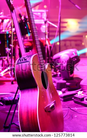 Guitar and other musical equipment on stage before concert