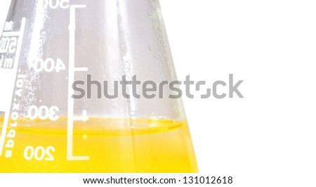laboratory flask with yellow liquid