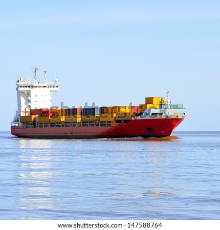 colorful cargo container ship sailing