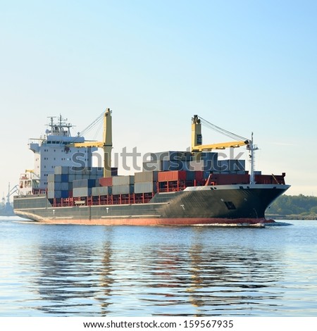 cargo container ship leaving port of Riga