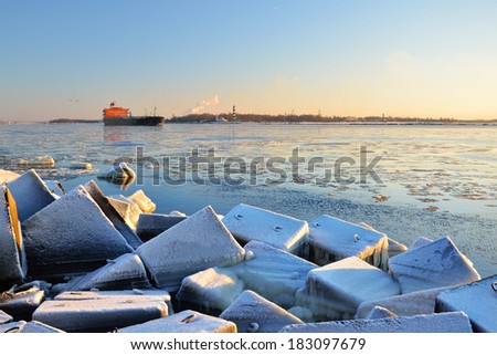 Cargo ship (Bulk carrier) sailing out of the port. Riga, Latvia