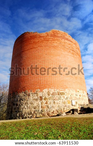 castle brick tower against blue sky. Sigulda, Latvia