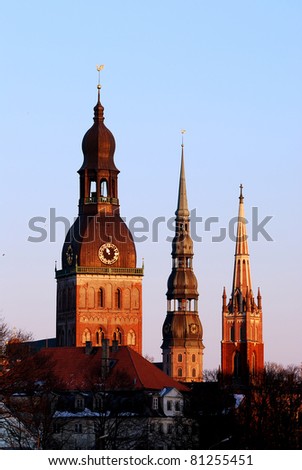 Latvian church towers in Riga at the sunset