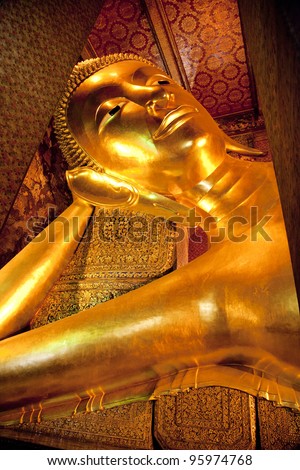 The Reclining Buddha (Phra Buddhasaiyas) at Wat Pho or Wat Phra Chettuphon Wimon Mangkhlaram Ratchaworamahawihan, Bangkok, Thailand.