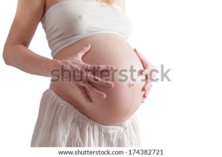 Belly of pregnant woman, 34 week of pregnancy (8th month), isolated on white background