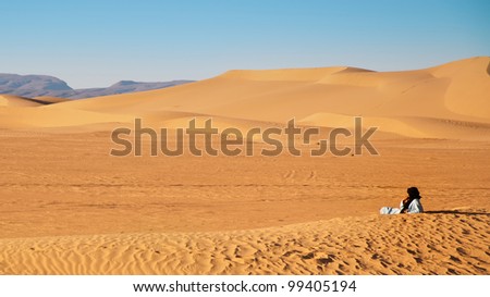 Sand dunes with a Tuareg man, Erg Chigaga, Moroccan Sahara