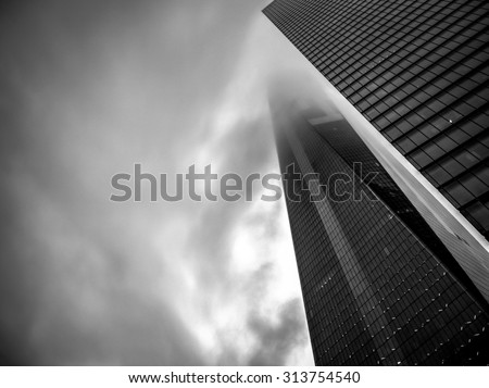 New York, USA - June 15, 2015: Black and white image of the One World Trade Center also named The Freedom Tower coverd by fog
