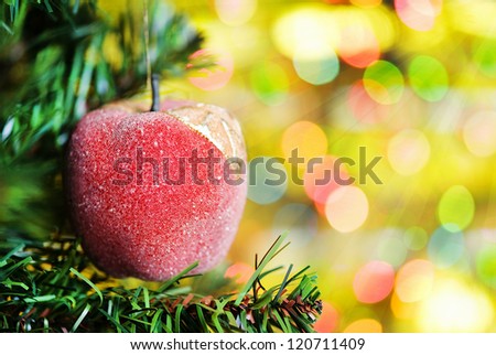 Christmas ball with fir tree on the shine background