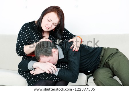 Woman comforting her crying man