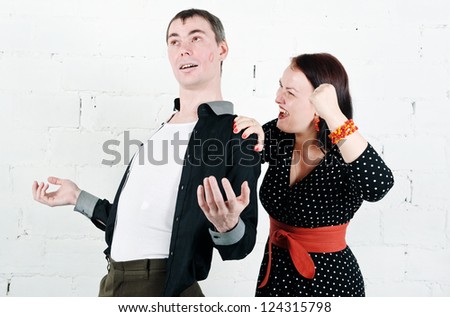 Jealous woman screaming at her kissed man