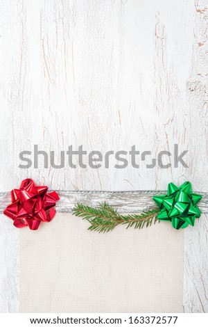 Christmas decoration with silver ribbon, canvas and fir branch