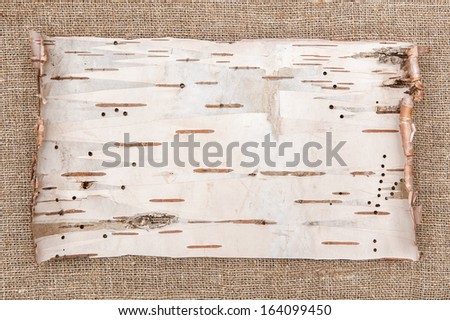 Birch bark on rude burlap background