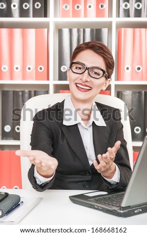 Business woman gesturing welcome