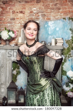 Smiling beautiful woman in medieval dress